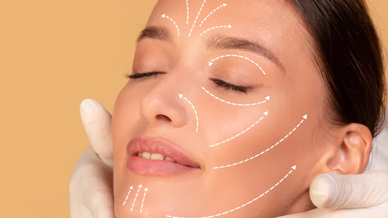Woman with white guide lines drawn across her face during a consultation